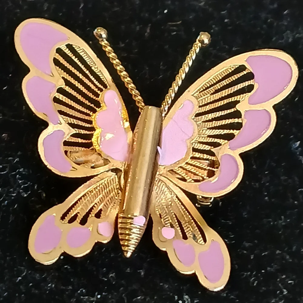 Vintage goldtone filigree butterfly brooch with pink accents